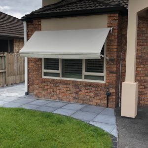 Window Awnings | Spring Arm Awning Motorized